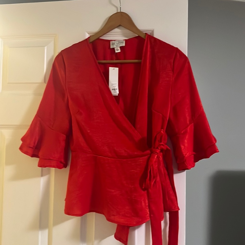 Beautiful never used peplum wrap blouse
